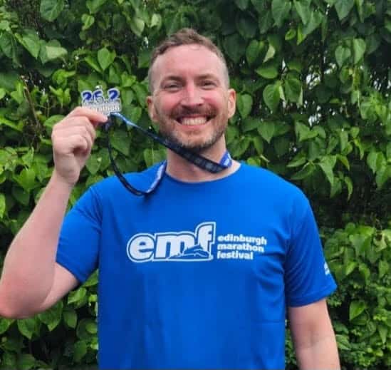 Colin Miller with his marathon medal